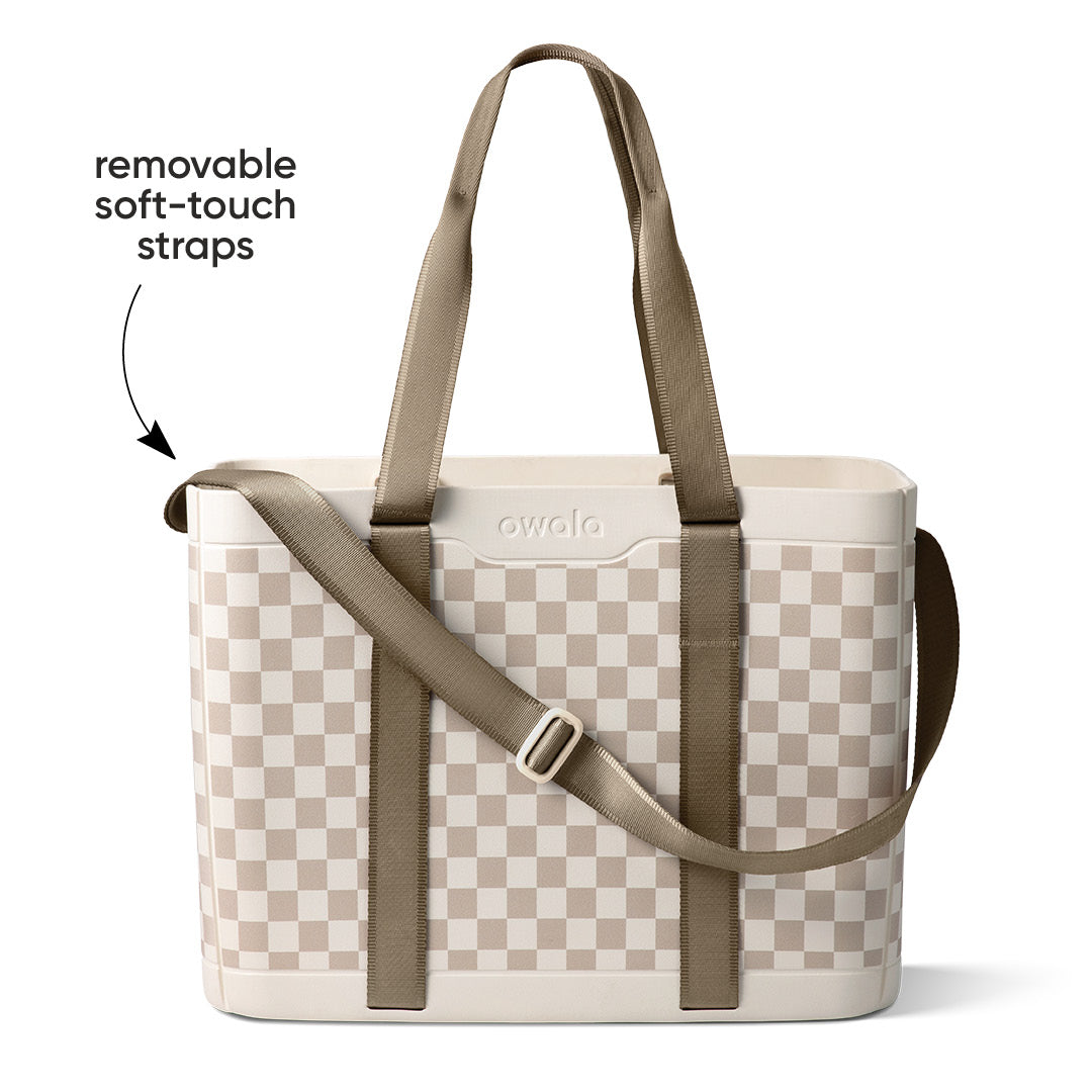 Owala Sun-Day Collapsible Tote in Checkin' In, cream and tan checker body with olive removable soft-touch straps including shoulder strap, with text overlay reading "removable soft-touch straps"