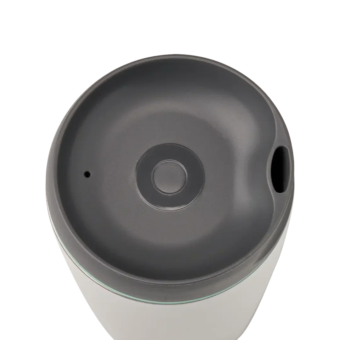 Owala SmoothSip 12oz in white body with gray lid and mint green accent ring, top view